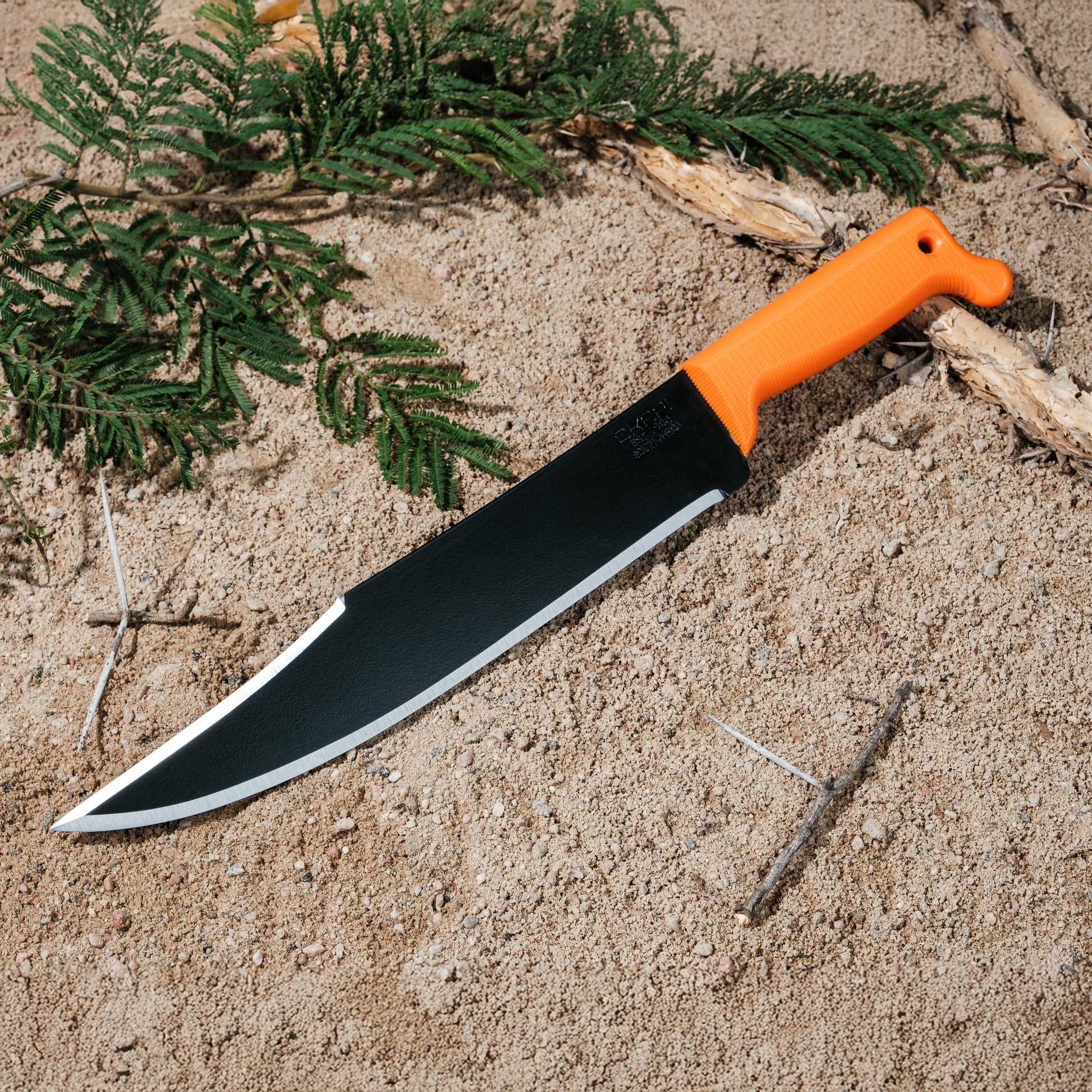 Okapi Bowie Machete with Okapi orange handle in the outdoors