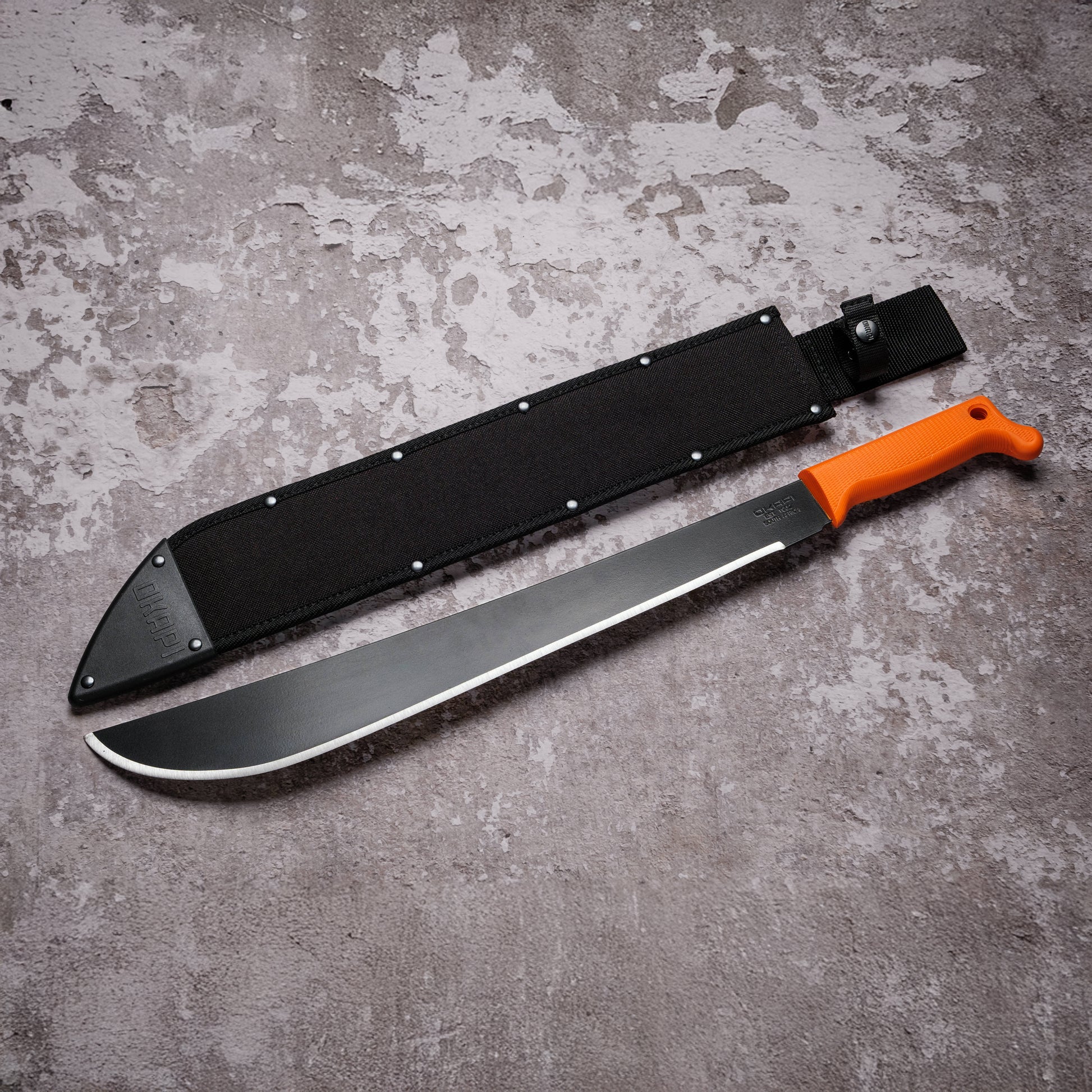 Okapi Latin Machete with black Sheath cover on grey background