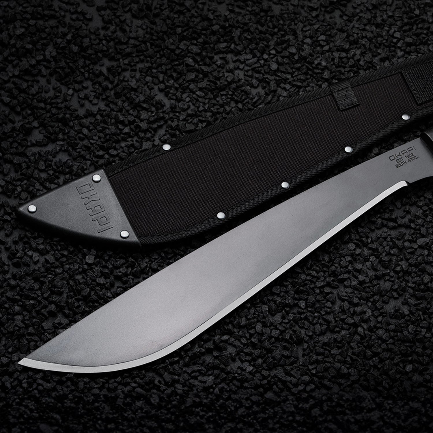Okapi Jungle Machete Sheath in black on black stone background