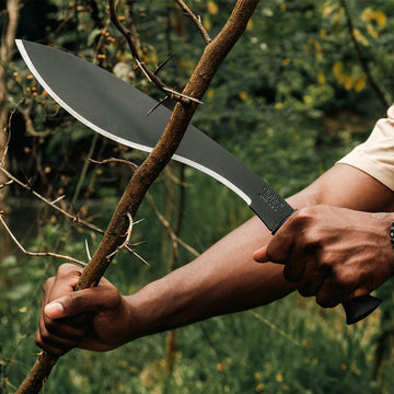 Outdoor lifestyle photo of Okapi Kukri machete with heavy-duty black handle