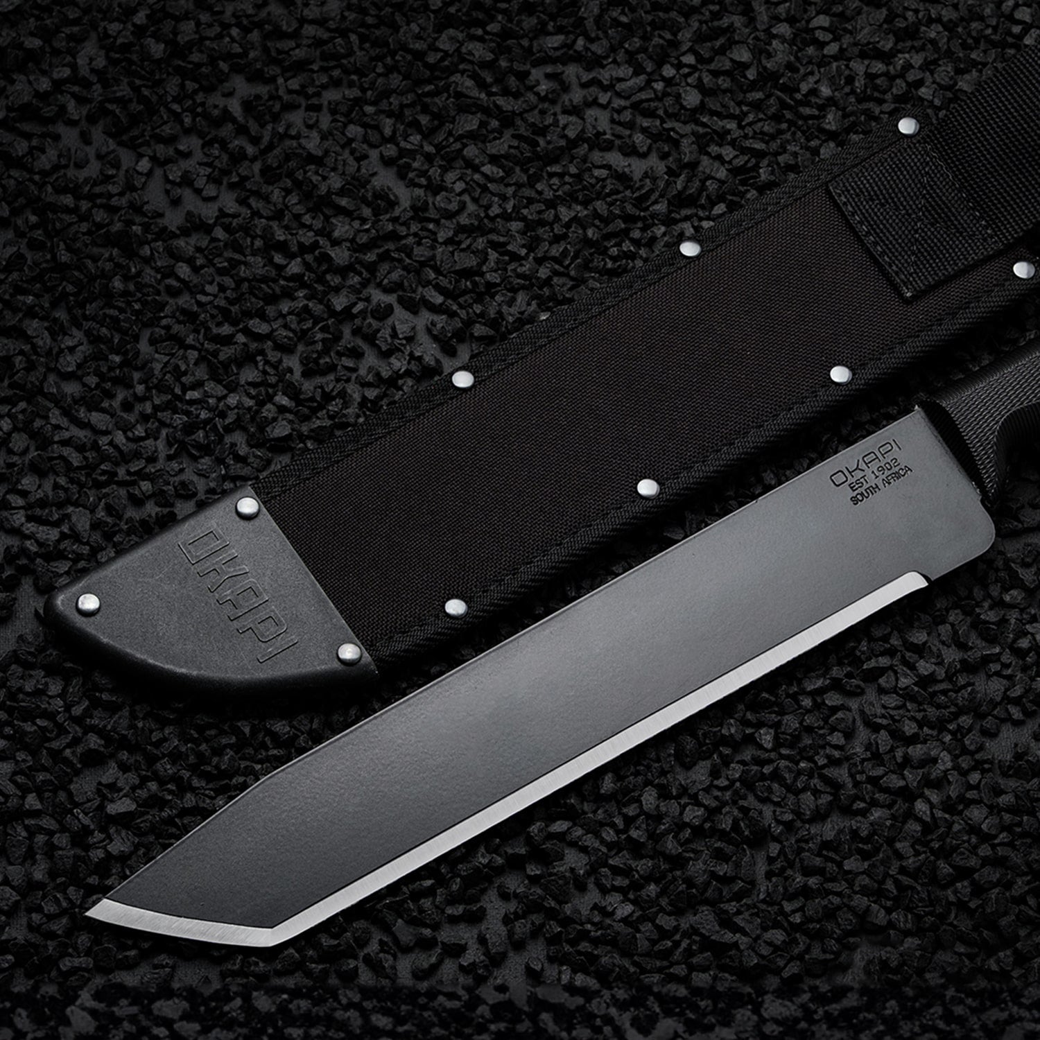Okapi O-Tanto Sheath in black on black stone background