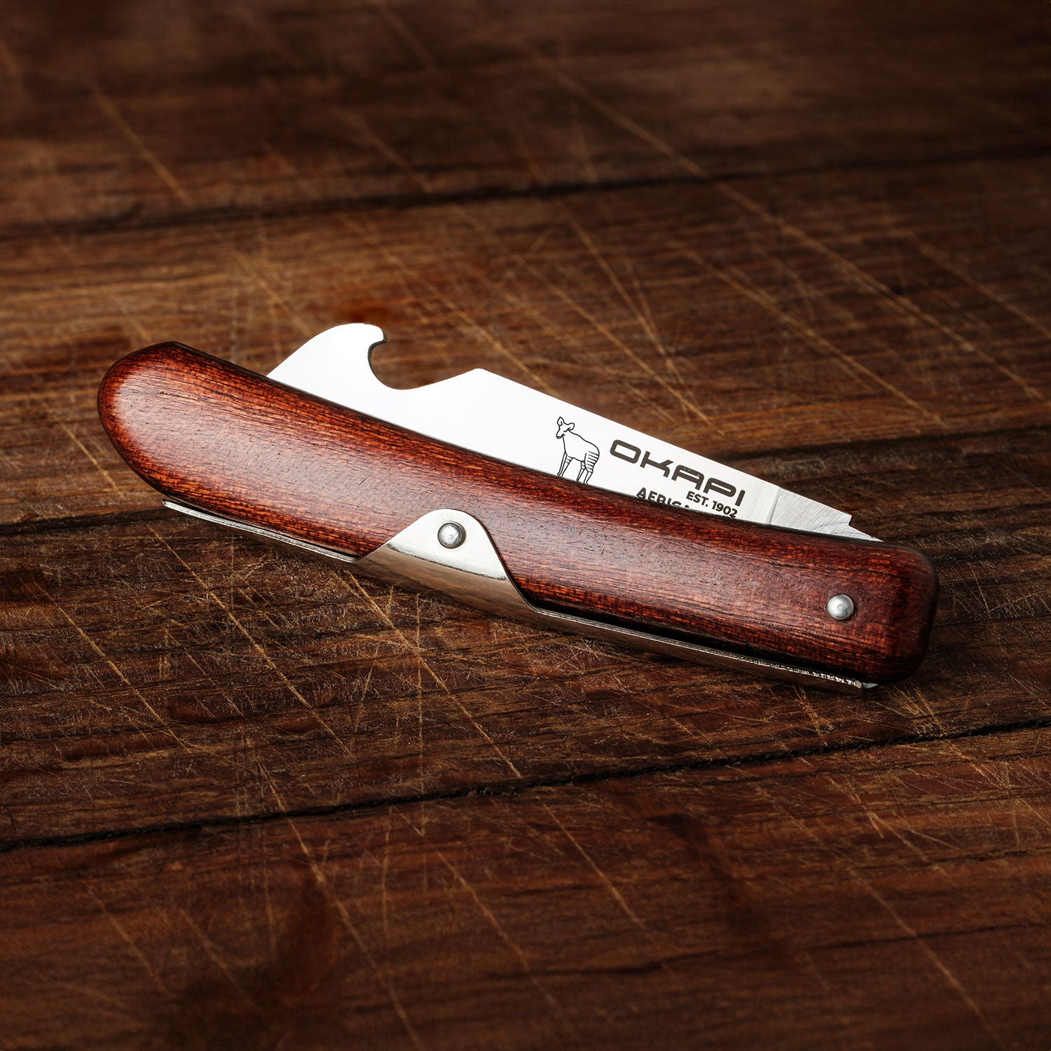 Okapi Biltong & Beer Knife folded on wooden background