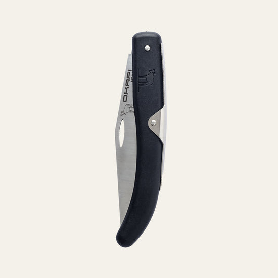 Closed Okapi folding knife with tactical black grip shown on white background