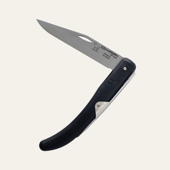 Compact Okapi folding knife with black handle for everyday carry, isolated on white