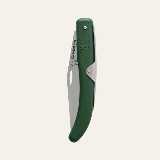 Okapi folding knife featuring forest green handle, shown closed against a clean white surface