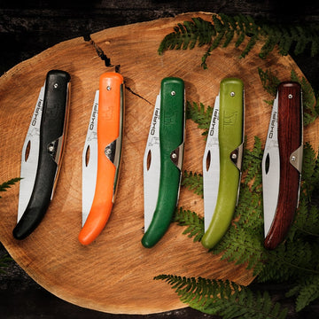 Collection of Okapi folding knives with a variety of coloured handles