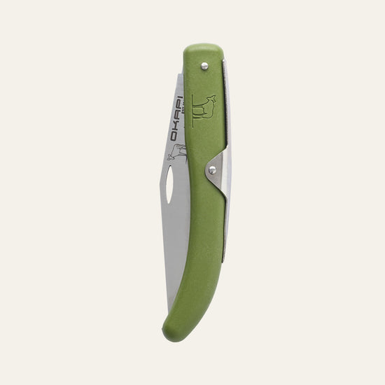 Closed Okapi utility knife featuring olive green synthetic handle, isolated on white
