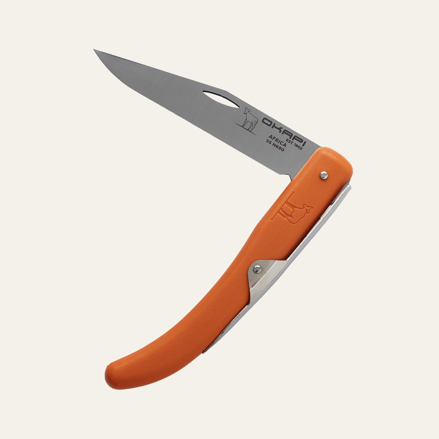 Okapi folding knife with high-visibility Okapi orange handle, resting on white surface
