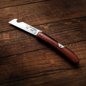 Okapi Biltong & Beer Knife on a wooden background for product image