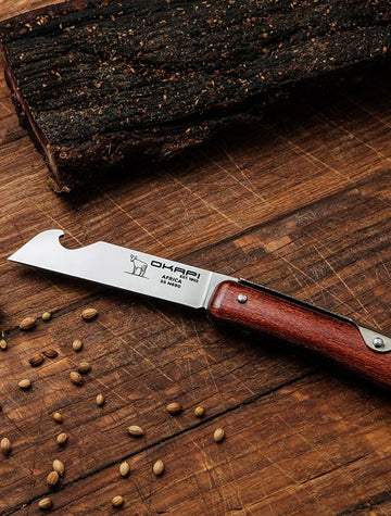 Okapi Biltong Knife with biltong sliced in the background